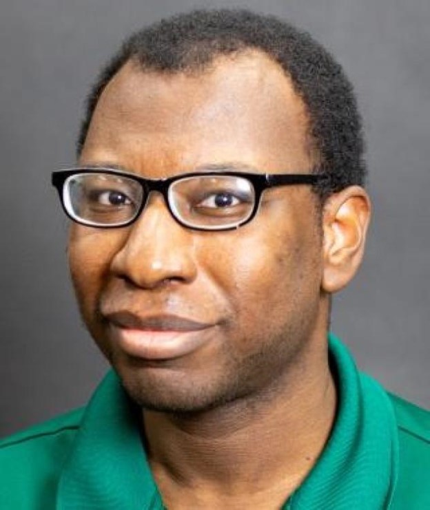 A portrait photo of Caleb Kamplain