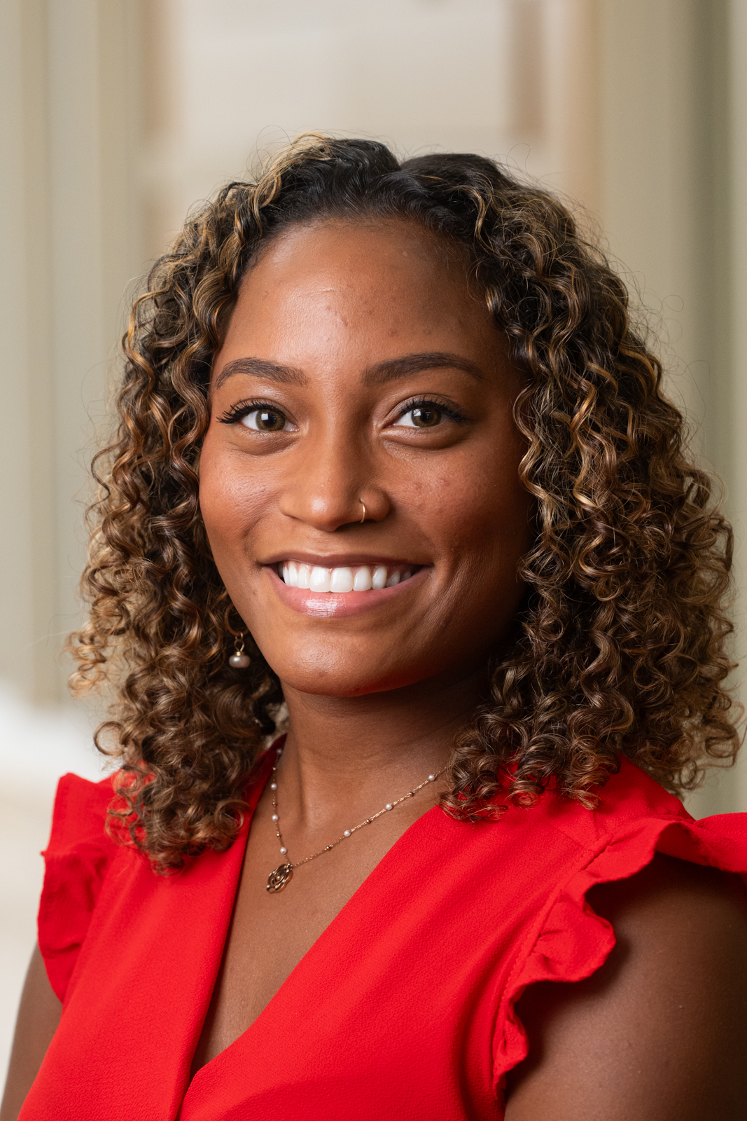 Young woman with curly hair smiling