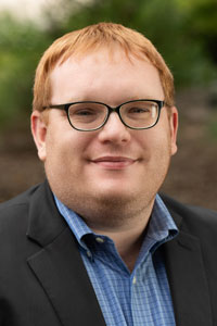 A portrait photo of Michael Tadlock-Jackson