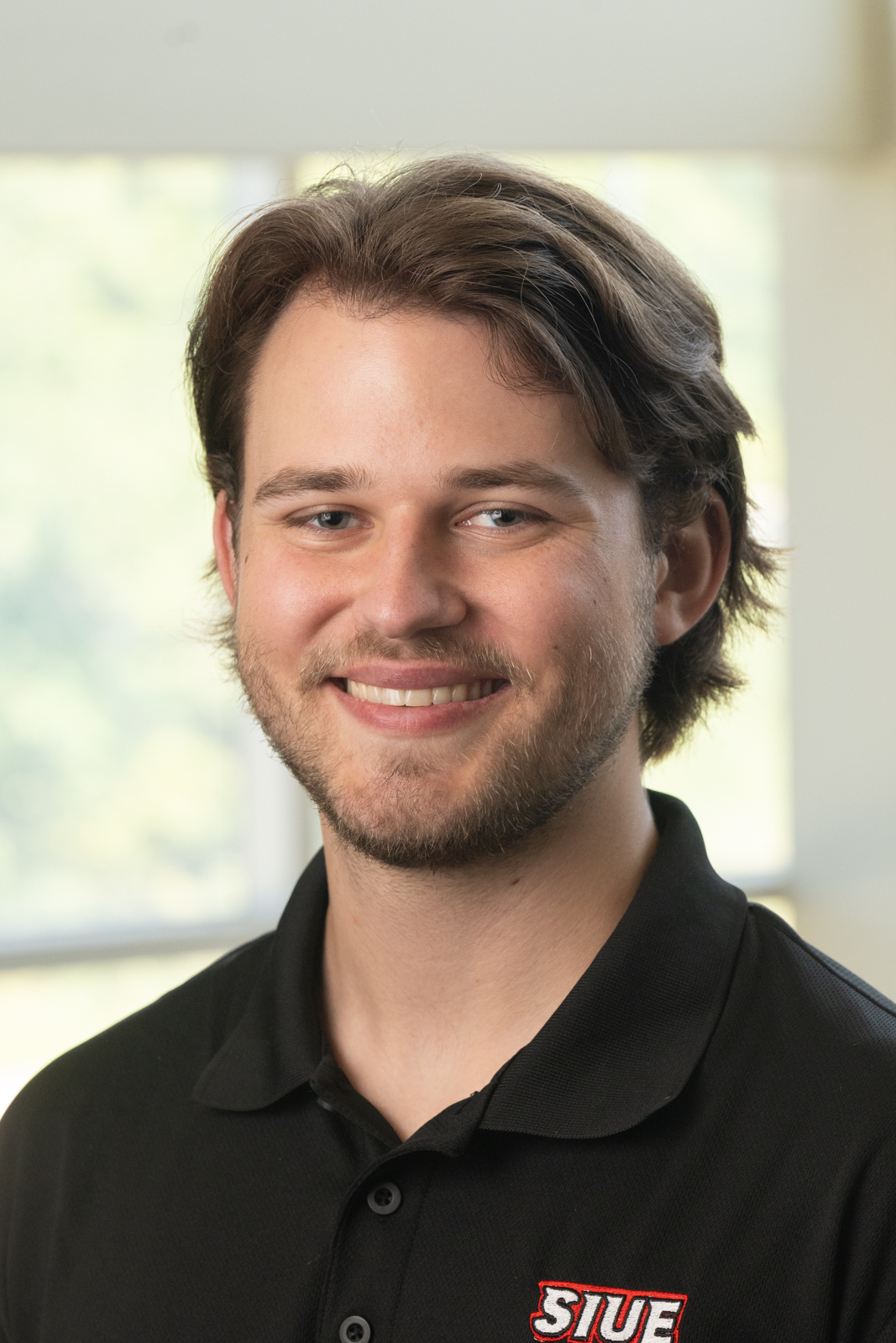 A portrait photo of Patrick Hill