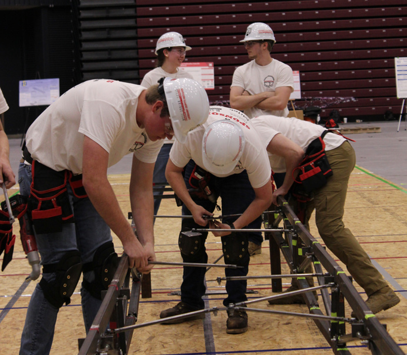 SIUE civil engineering students assemble their steel bridge.