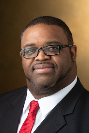 A portrait photo of Dr. Tim Staples