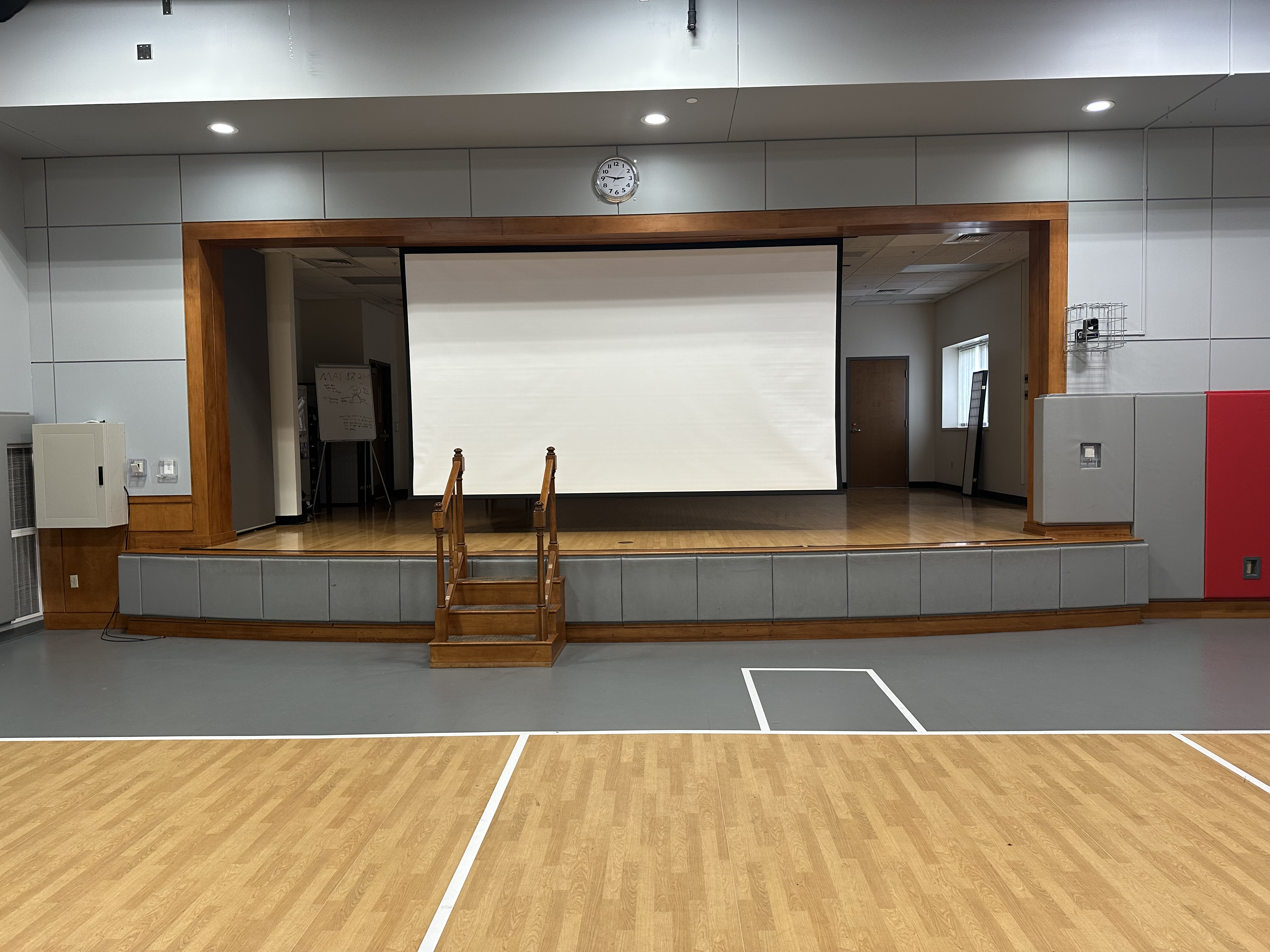Image of the Building D Multipurpose Room with the screen lowered