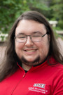 A portrait photo of Logan Wilson (he/him)