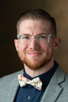 A portrait photo of Mitchell Haas, MSLIS