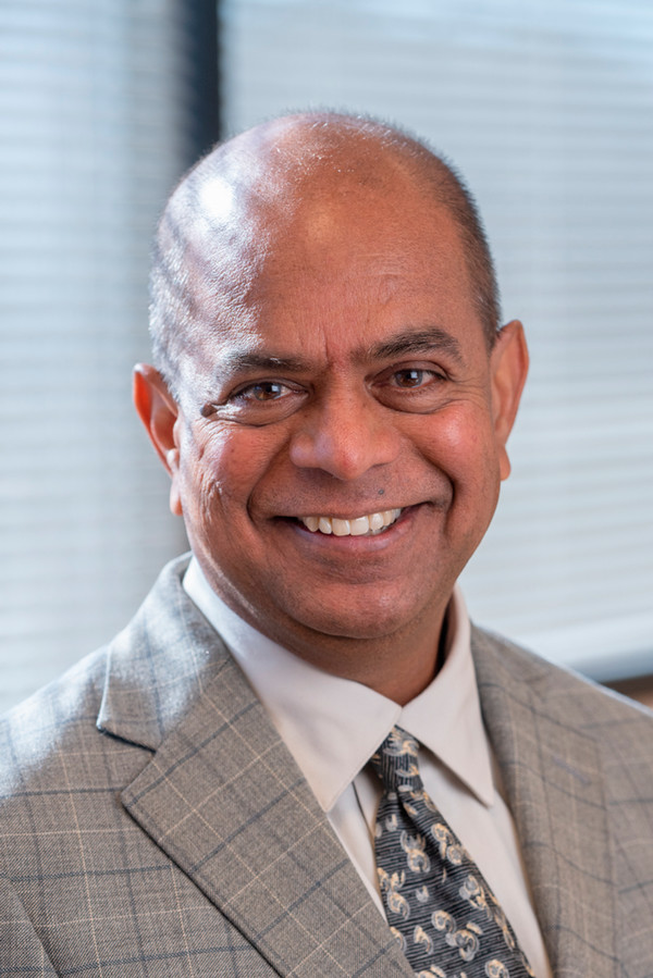 A portrait photo of Praveen Vadlani, Ph.D., MBA