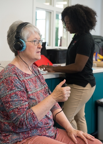 Karen File had her hearing screened by SIUE speech-language pathology graduate student Jenee' Brown.