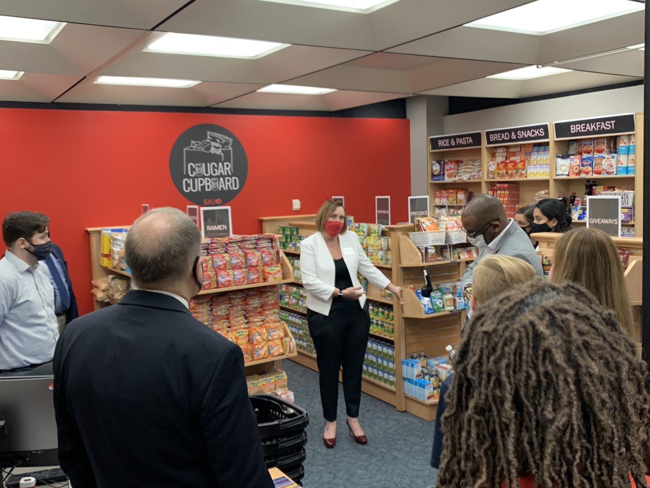 SIUE’s Carolyn Compton offer area legislators a tour the Cougar Cupboard. 