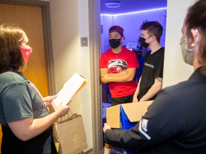 During the House Calls event, first-year students (back L-R) Ben Michael, of Taylorville, and Ryan Altherr, of Decatur, visited with the School of Nursing’s (front L-R) Amy Kief and Sara Ortiz with Campus Recreation.