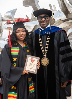 SIUE Chancellor James T. Minos (left) stands alongside SIUE East St. Louis Charter High School graduate Kyla Anderson.