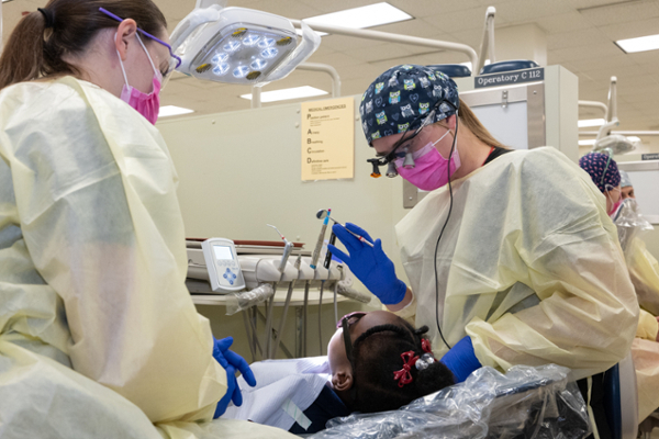 Dentists working on patient
