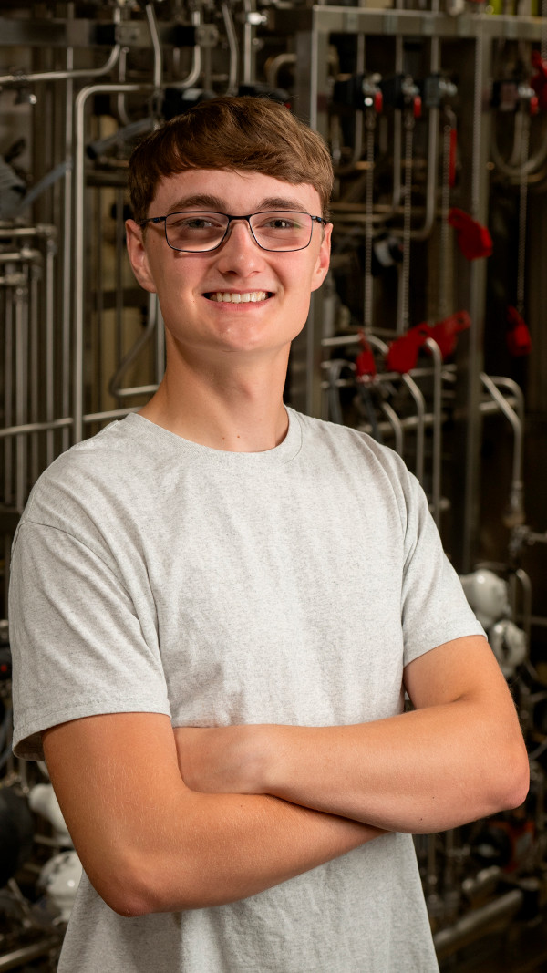 Portrait of Andrew Platto standing