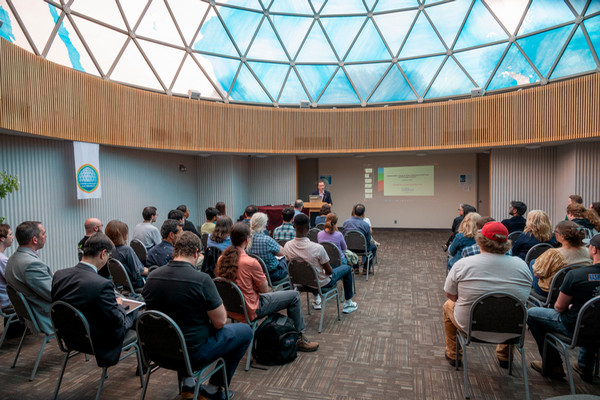 Professor Celik in front of audience inside Fuller Dome