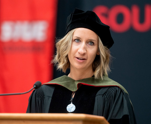 HollyAnn Jacobs gives keynote speech at podium