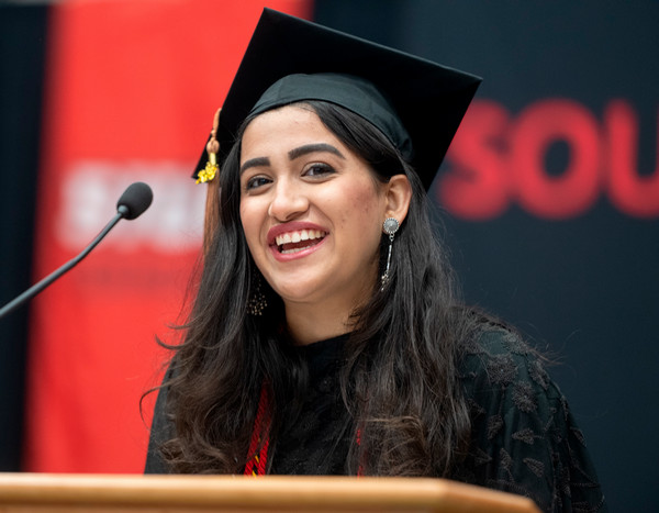 Kashish Tandon gives speech at podium