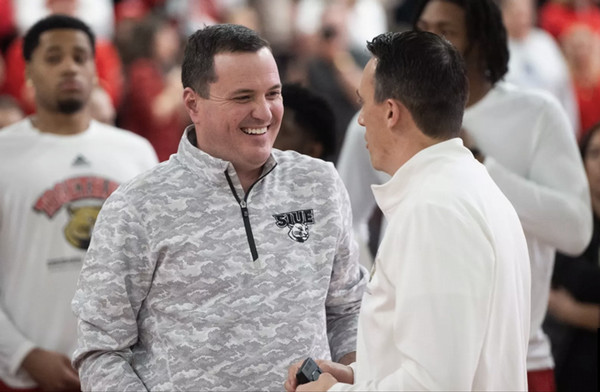 Andrew Gavin in conversation with basketball coach