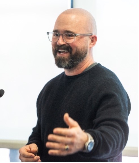 Photo of keynote speaker speaking Luke Lambert