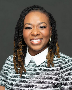 portrait of Dye in a woven knit sweater