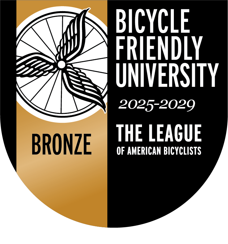 Bicycle Friendly University Bronze badge for 2025–2029 from the League of American Bicyclists, featuring a winged bicycle wheel and gold-and-black shield design.