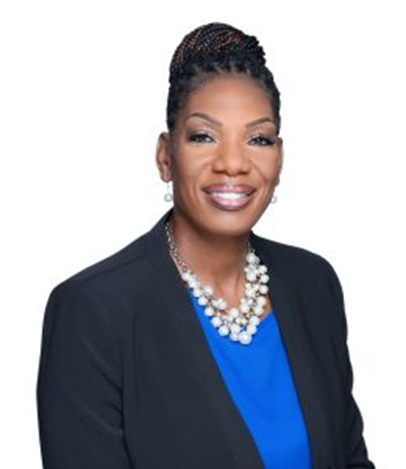 Portrait of Nicole Woods in a blue shirt and black suit