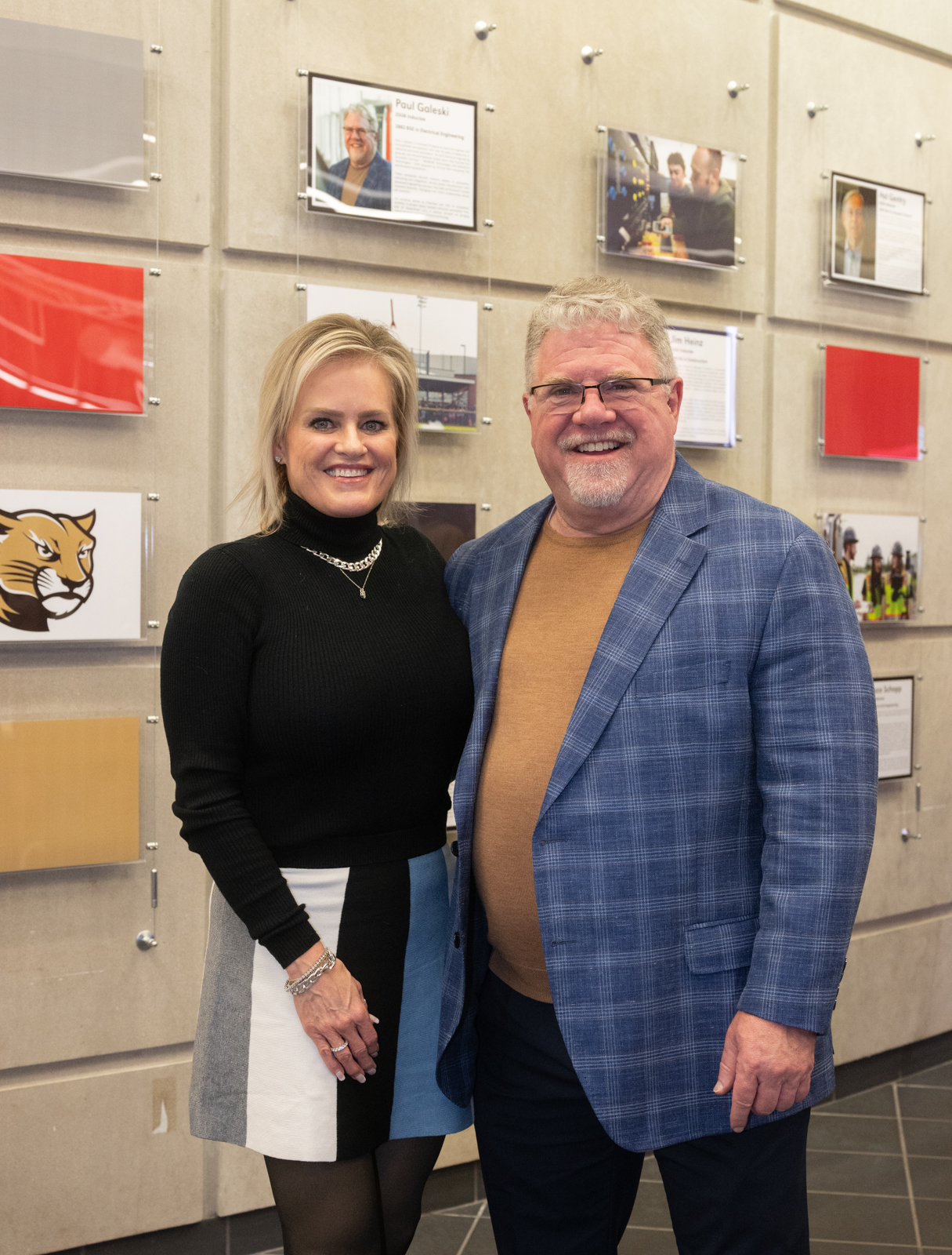 Photo of Galeski and Partner standing in front of the newly mounted Wall of Fame in the Engineering Building