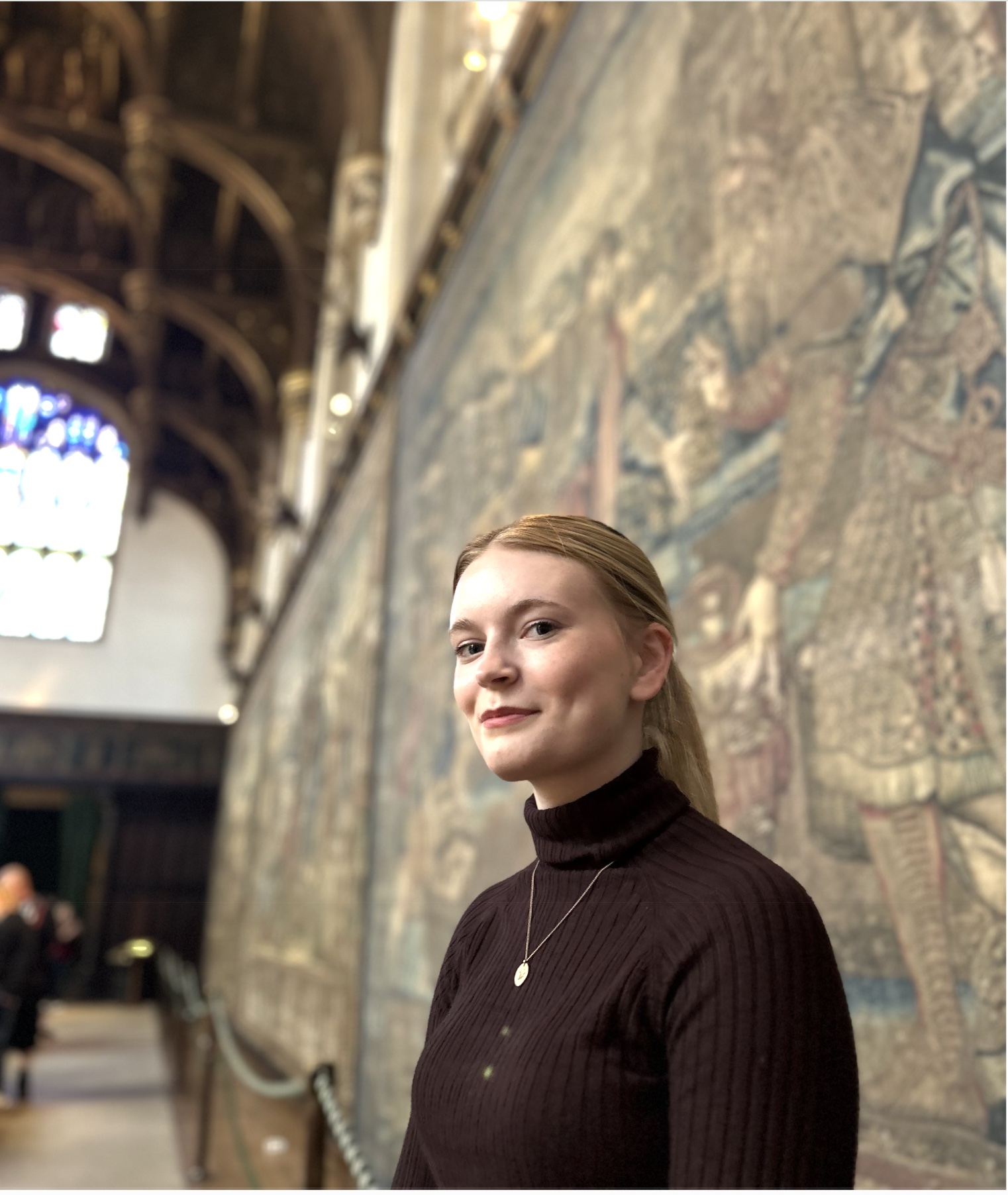 Portrait of Ella Young standing in nature