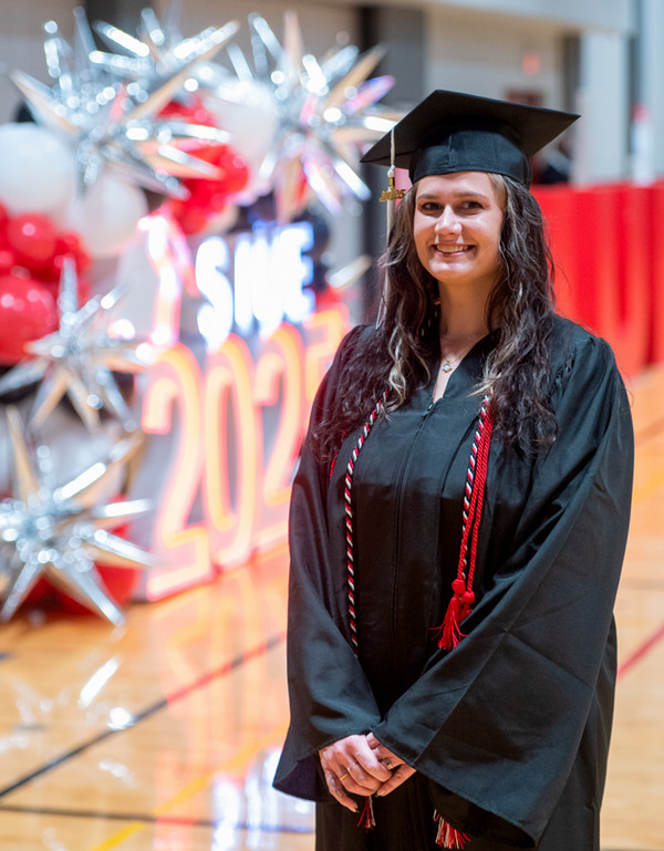 Mia Waldo stands by commencement light display