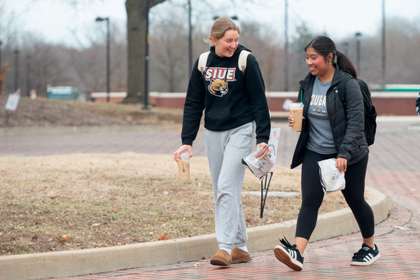 Students walking on the quad on a cloudy day