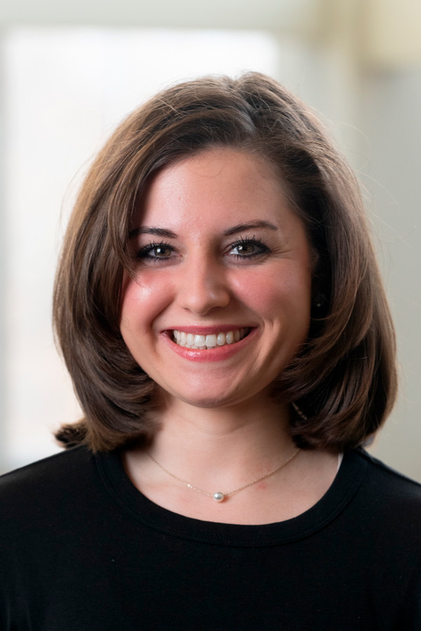 portrait of Alexix Yociss smiling 