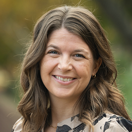Portrait of Mallory Sidarous outside wearing a printed blouse