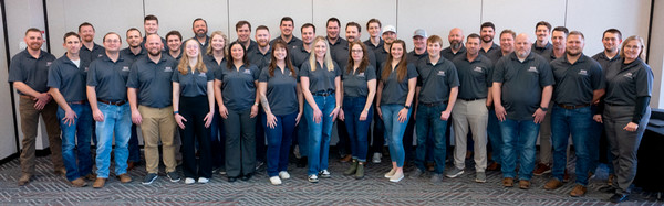 Rows of graduates of the CLI program dressed in their polo shirts