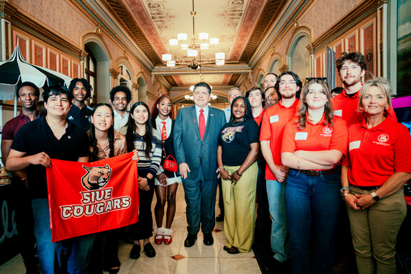 Group photo of SIUE students and staff on the rotunda at the Illinois Capitol with Gov. Pritzker.