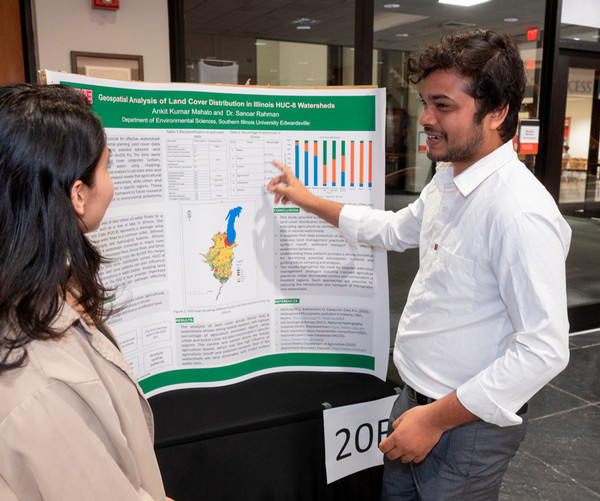 Student shows poster project