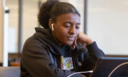 SIUE Student working at a computer.