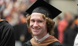 SIUE student with a graduation cap on.