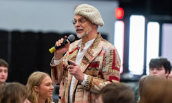 SIUE Faculty talks into a microphone.