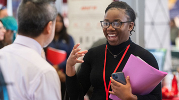 A SIUE student at a graduate school open house.