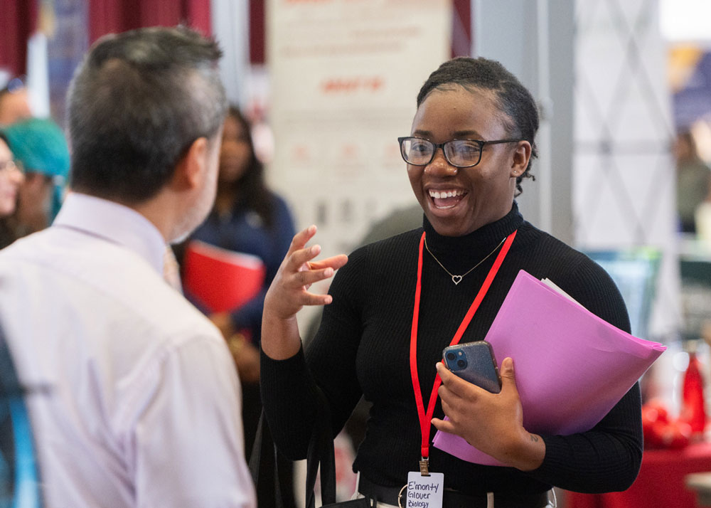 A SIUE student at a graduate school open house. 