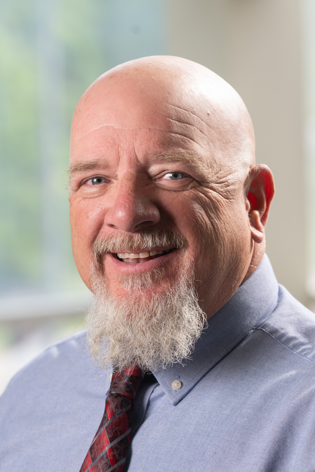 A portrait photo of Doug James